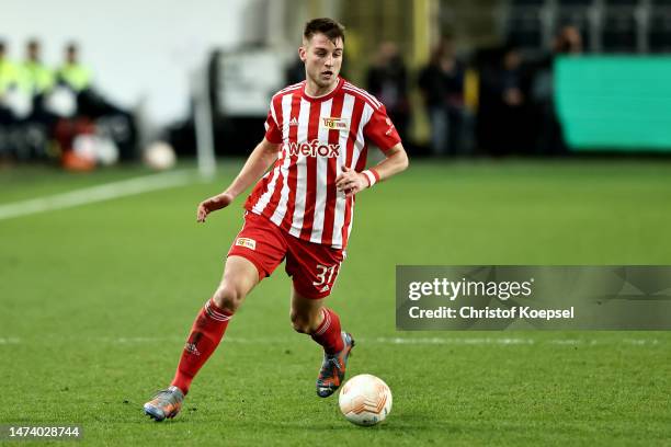 Robin Knoche of 1. FC Union Berlin runs with the ball during the UEFA Europa League round of 16 leg two match between Royale Union Saint-Gilloise and...