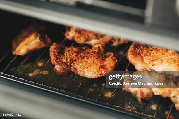 grilled chicken thighs in the oven - chicken thigh stock-fotos und bilder
