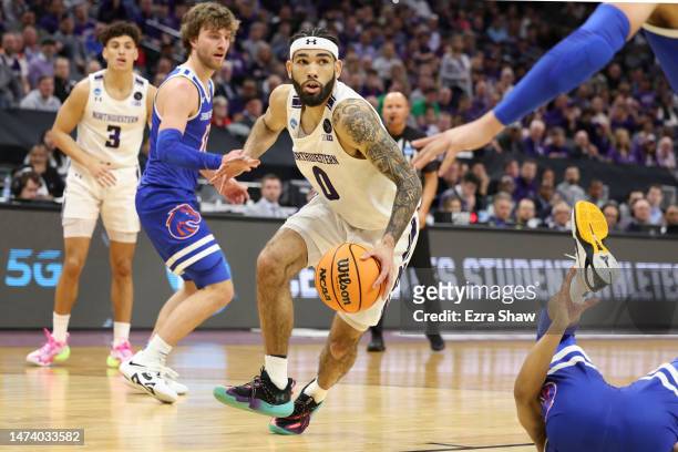 Boo Buie of the Northwestern Wildcats handles the ball against the Boise State Broncos during the first half in the first round of the NCAA Men's...