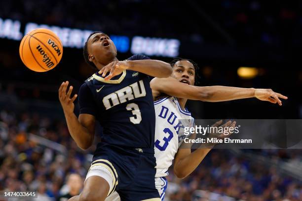 Max Abmas of the Oral Roberts Golden Eagles reacts as he is fouled by Jeremy Roach of the Duke Blue Devils during the second half in the first round...