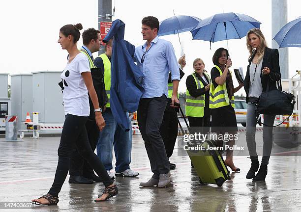 Mario Gomez , his girlfriend Silvia Meichel and Sarah Brandner, girlfriend of Bastian Schweinsteiger are pictured at the arrival at the airport on...