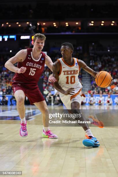 Sir'Jabari Rice of the Texas Longhorns drives to the basket against Tucker Richardson of the Colgate Raiders during the second half in the first...