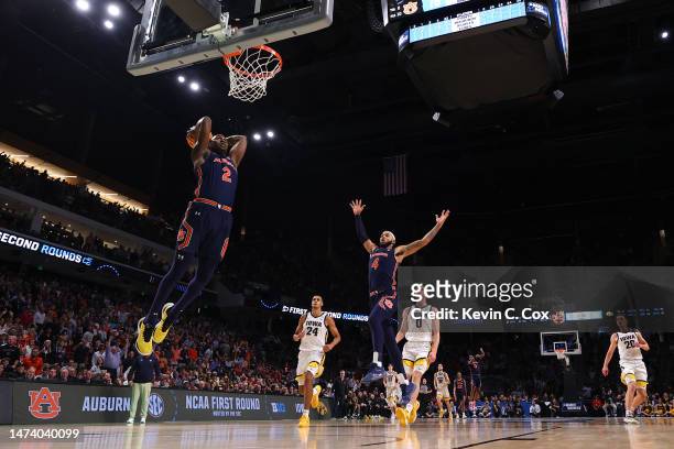 Jaylin Williams of the Auburn Tigers goes up for a dunk during the second half against the Iowa Hawkeyes in the first round of the NCAA Men's...