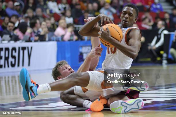 Sir'Jabari Rice of the Texas Longhorns battles Tucker Richardson of the Colgate Raiders for a loose ball during the second half in the first round of...