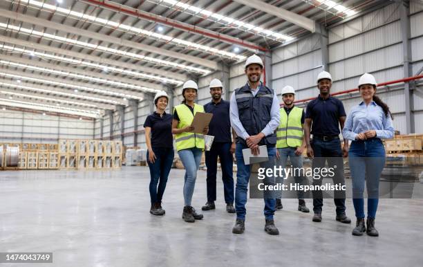 group of employees working at a distribution warehouse - health and safety stock pictures, royalty-free photos & images