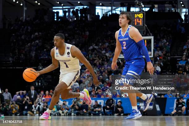 Chase Audige of the Northwestern Wildcats works the ball around Tyson Degenhart of the Boise State Broncos during the second half in the first round...