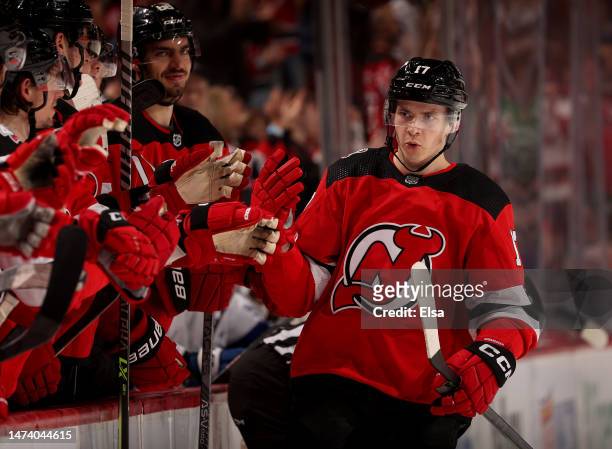 Yegor Sharangovich of the New Jersey Devils is congratulated by teammates after he got the puck past Andrei Vasilevskiy of the Tampa Bay Lightning...
