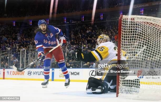 Mika Zibanejad of the New York Rangers scores at 2:51 of the first period against Tristan Jarry of the Pittsburgh Penguins at Madison Square Garden...