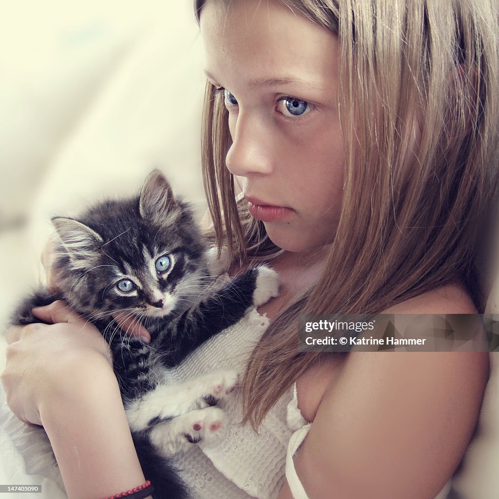 Girl with baby kitten