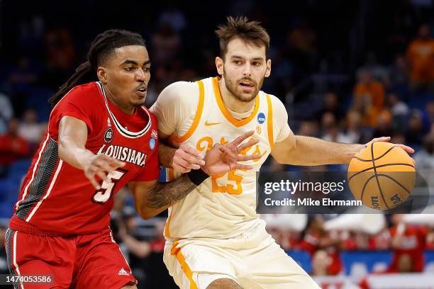 Santiago Vescovi of the Tennessee Volunteers handles the ball against Jalen Dalcourt of the Louisiana Lafayette Ragin Cajuns during the second half...