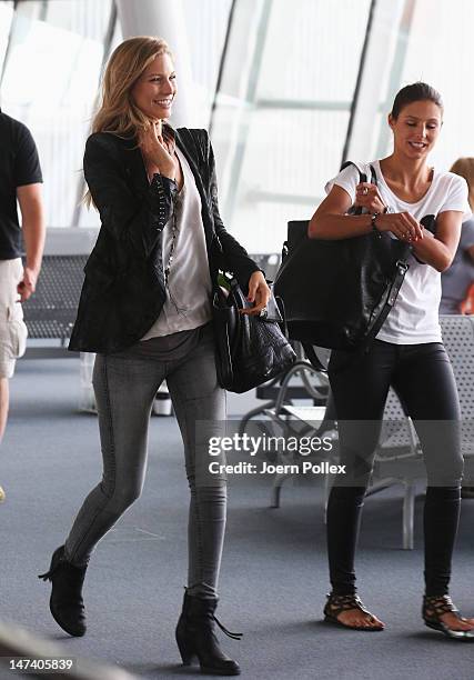 Sarah Brandner , girlfriend of Bastian Schweinsteiger and Silvia Meichel, girlfriend of Mario Gomez are pictured at the Warsaw airport following...