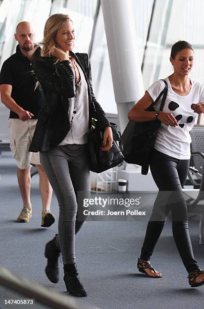 Sarah Brandner , girlfriend of Bastian Schweinsteiger and Silvia Meichel, girlfriend of Mario Gomez are pictured at the Warsaw airport following...