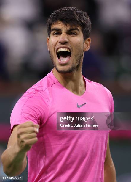 Carlos Alcaraz of Spain celebrates defeating Felix Auger-Aliassime of Canada in the quarter finals during the BNP Paribas Open on March 16, 2023 in...