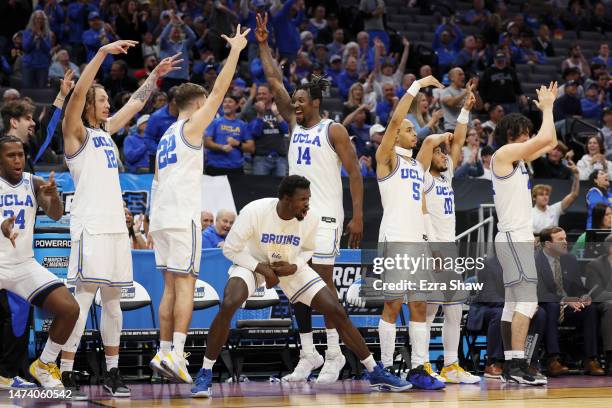 The UCLA Bruins celebrates a three point basket during the second half of a game against the North Carolina-Asheville Bulldogs in the first round of...