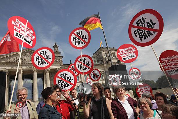 Demonstrators, including representatives of Die Linke left-wing political party, protest against the European Union fiscal pact outside the...