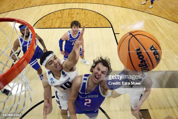 Tyson Degenhart of the Boise State Broncos shoots over Tydus Verhoeven of the Northwestern Wildcats during the second half in the first round of the...