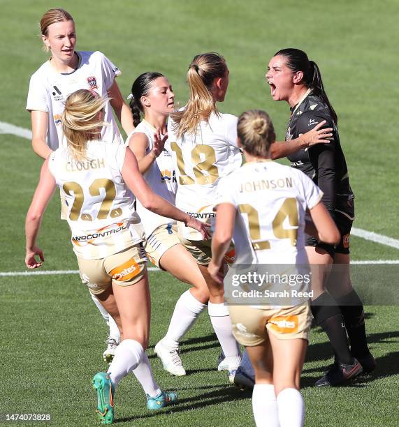 Claire Coelho, Goalkeeper of the Newcastle Jets reacts with team mates after saving a free kick from Maruschka Waldus of Adelaide United during the...