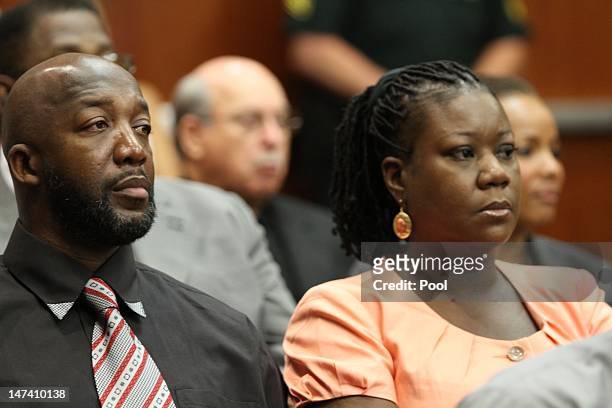 Tracy Martin and Sybrina Fulton, parents to Trayvon Martin, sit in a Seminole County courtroom during the bond hearing for George Zimmerman on June...