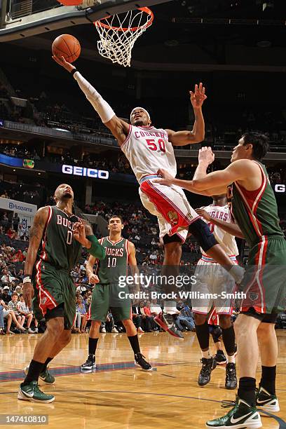 Corey Maggette of the Charlotte Bobcats drives to the basket against the Milwaukee Bucks at the Time Warner Cable Arena on March 23, 2012 in...