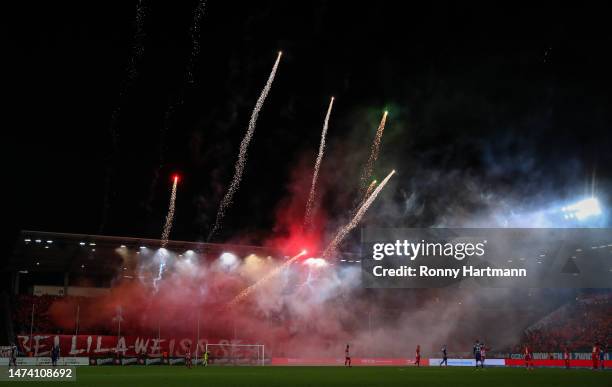 Supporters of Zwickau set off pyrotechnics during the 3. Liga match between FSV Zwickau and Erzgebirge Aue at GGZ Arena on March 14, 2023 in Zwickau,...