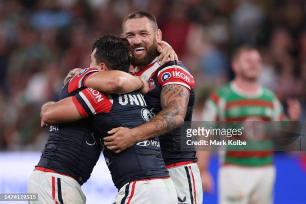 Victor Radley, Brandon Smith and Jared Waerea-Hargreaves of the Roosters celebrate winning the round three NRL match between Sydney Roosters and...