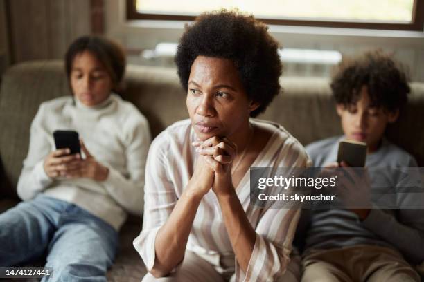 they are always on their phones! - people family group sad stock pictures, royalty-free photos & images