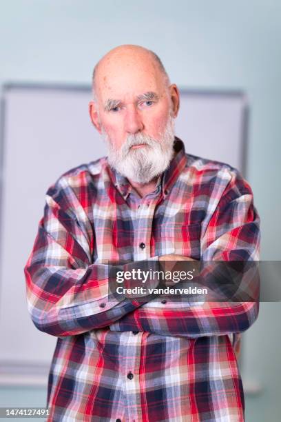 portrait of an ordinary, elderly man wearing a plaid shirt - hairy old man 個照片及圖片檔