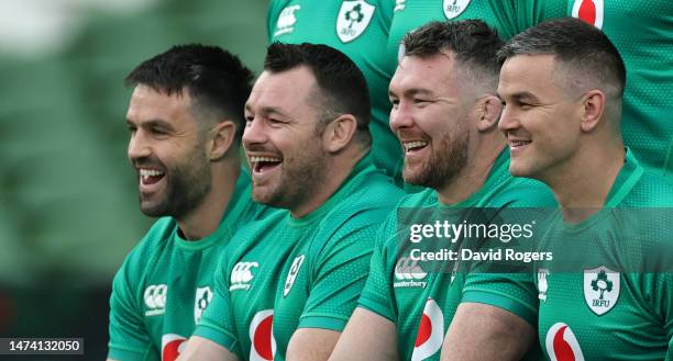 Conor Murray, Cian Healy, Peter O'Mahony and Johnny Sexton laugh as they pose for a team photograph during the Ireland captain's run at the Aviva...