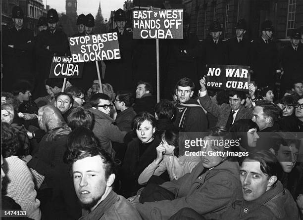 Protesters stage a sit-in during a demonstration against the Cuban missile crisis October 24, 1962 in London, United Kingdom. Former Russian and U.S....
