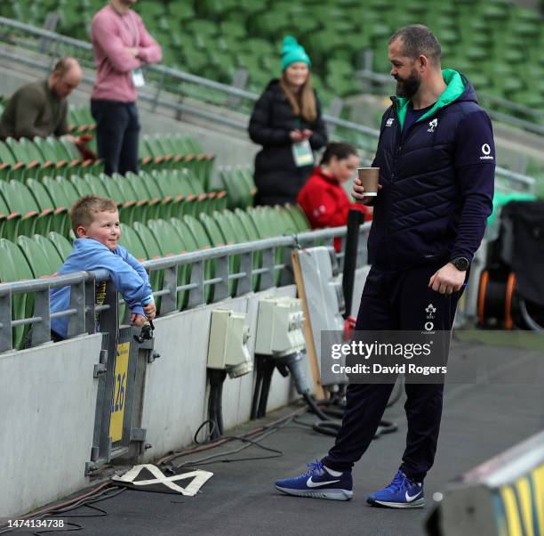 Andy Farrell, the Ireland head coach, talks with his grandchild, Tommy, during the Ireland captain's run at the Aviva Stadium on March 17, 2023 in...