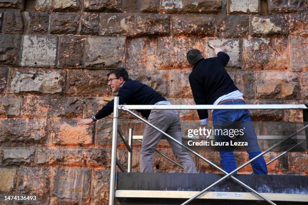 The mayor of Florence Dario Nardella cleans the facade of Palazzo Vecchio after protestors from the action group Ultima Generazione smeared Palazzo...