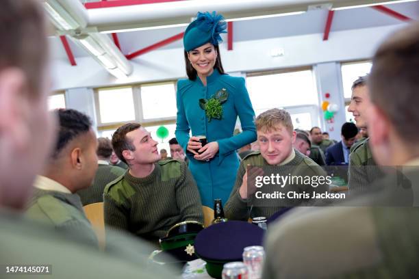 Catherine, Princess of Wales meets with members of the Irish Guards and enjoys a glass of Guinness during the St. Patrick's Day Parade at Mons...