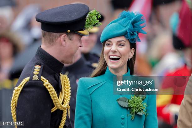 Prince William, Prince of Wales and Catherine, Princess of Wales laughing during the St. Patrick's Day Parade at Mons Barracks on March 17, 2023 in...