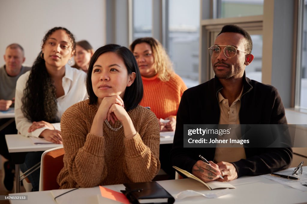 Group of adults sitting in class