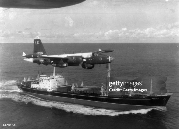 Neptune U.S. Patrol plane flies over a Soviet freighter during the Cuban missile crisis in this 1962 photograph. Former Russian and U.S. Officials...