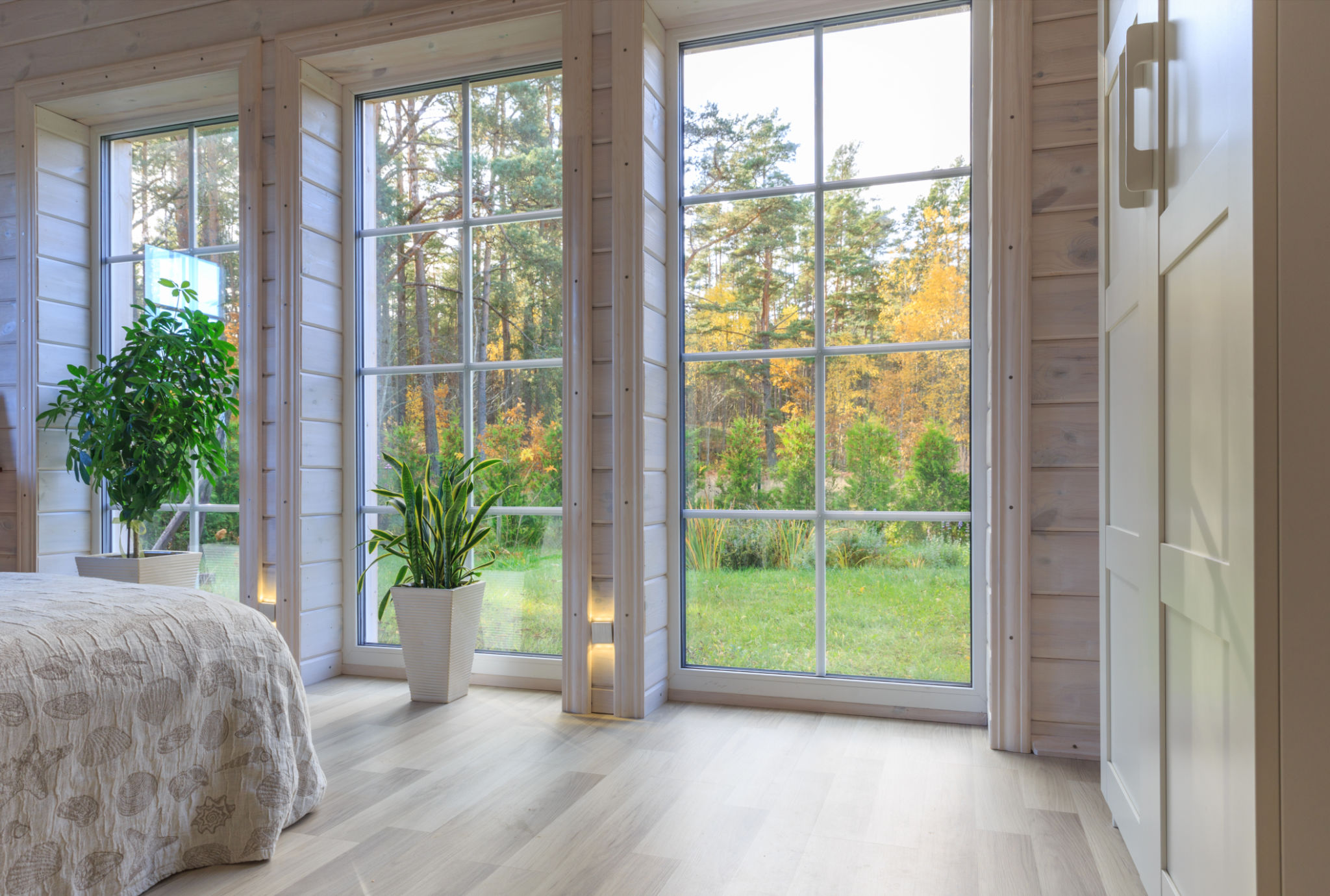 Bright photo studio interior with big window, high ceiling, white wooden floor Bright photo studio interior with big window, high ceiling, white wooden floor