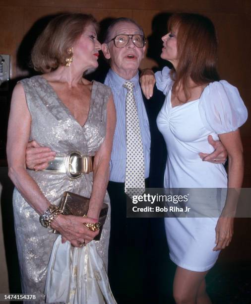 Legendary Comedian Milton Berle is joined by his wife Ruth Berle and Actress Tina Louise during tribute to Berle onboard the RMS Queen Mary, circa....