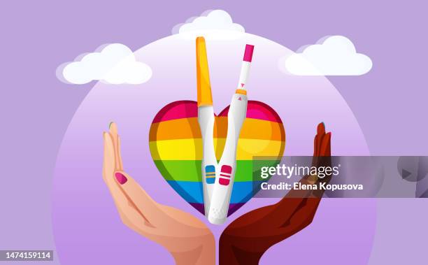 lgbt and pregnancy planning concept in flat style. women's hands of different races hold a rainbow heart with positive pregnancy tests with two stripes on an abstract color background. - ovulation stock illustrations