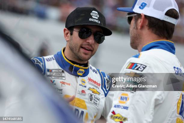 Chase Elliott, driver of the NAPA Auto Parts Chevrolet, and crew chief Alan Gustafson talk on the grid prior to the NASCAR Cup Series 65th Annual...