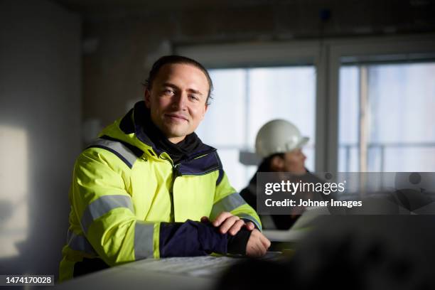 male engineer at building site - construction worker pose stock pictures, royalty-free photos & images