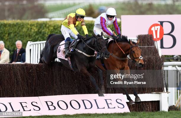 Paul Townend on board Galopin Des Champs jumps the last ahead of Harry Cobden on board Bravemansgame on their way to winning the Boodles Cheltenham...