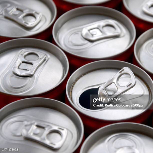 many aluminium soda drink cans advertising for soda drinks or tin cans mass manufacturing,romania - open romania imagens e fotografias de stock