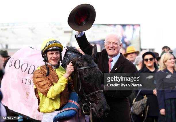 Paul Townend poses alongside Trainer Willie Mullins after winning the Boodles Cheltenham Gold Cup Chase on board Galopin Des Champs during day four...