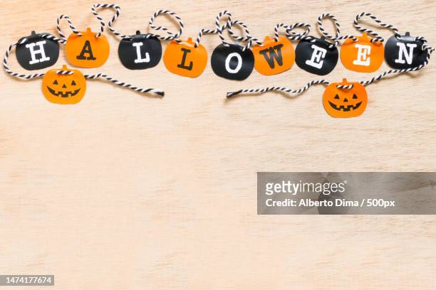 halloween flags,black and orange flags on wooden background,romania - halloween text stock pictures, royalty-free photos & images