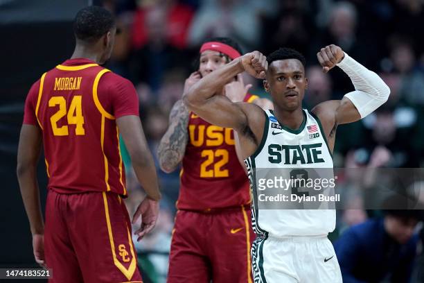 Tyson Walker of the Michigan State Spartans celebrates after making a basket and receiving a foul against the USC Trojans during the first half in...