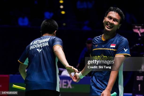 Mohammad Ahsan and Hendra Setiawan of Indonesia celebrate the victory in the Men's Doubles quarter finals match against Liu Yuchen and Ou Xuanyi of...