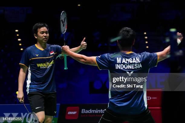 Mohammad Ahsan and Hendra Setiawan of Indonesia celebrate the victory in the Men's Doubles quarter finals match against Liu Yuchen and Ou Xuanyi of...