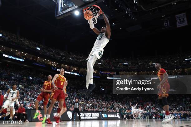 Mady Sissoko of the Michigan State Spartans dunks the ball against the USC Trojans during the first half in the first round game of the NCAA Men's...