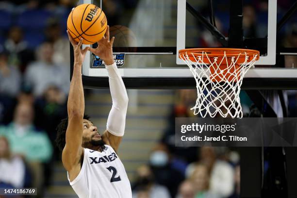 Jerome Hunter of the Xavier Musketeers dunks against the Kennesaw State Owls during the first half in the first round of the NCAA Men's Basketball...