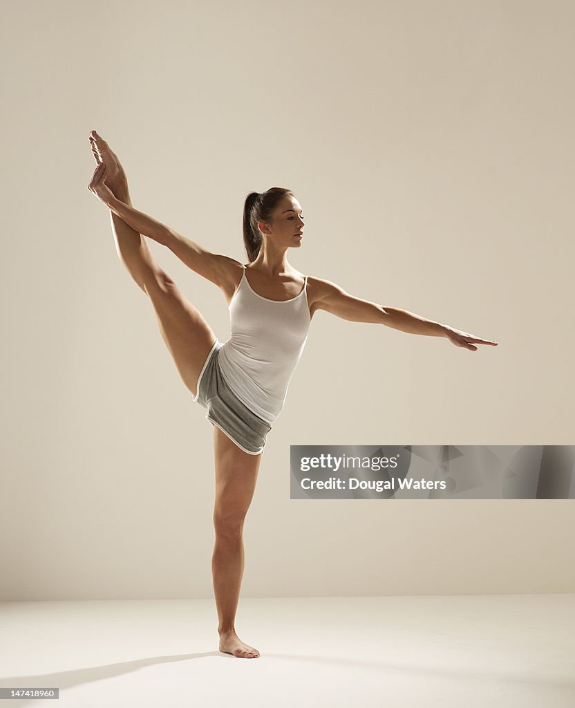 Woman exercising on white background.